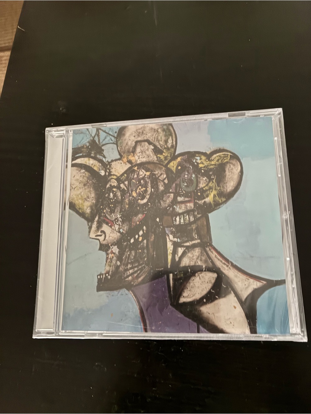 Travis Scott CD with Blue and Purple Cover Art
